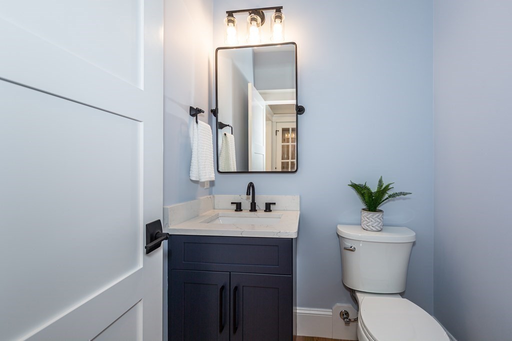 4 Whitcomb Street Natick, MA 01760 - Photo 13 of 42 a bathroom with a toilet sink and mirror