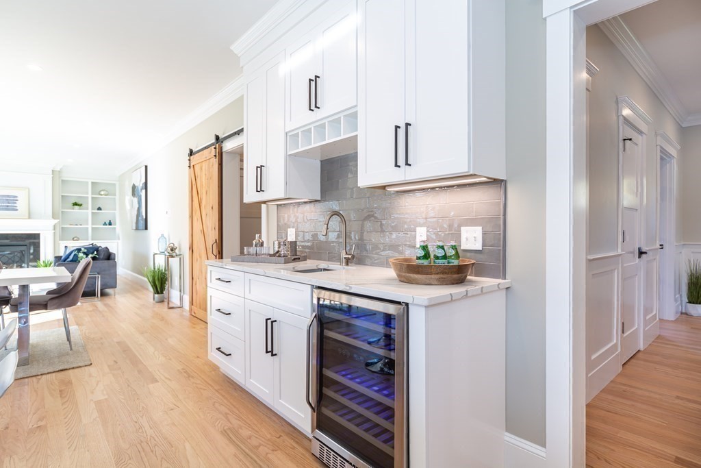 4 Whitcomb Street Natick, MA 01760 - Photo 15 of 42 a kitchen with stainless steel appliances granite countertop a stove a sink and a refrigerator
