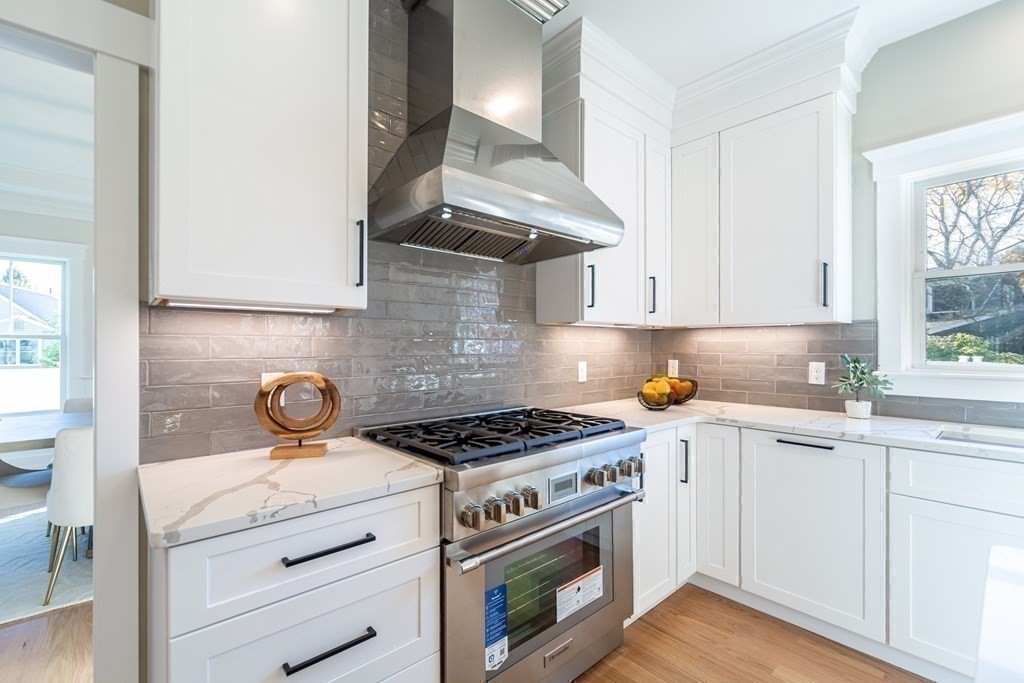 4 Whitcomb Street Natick, MA 01760 - Photo 16 of 42 a kitchen with a stove and a white cabinets
