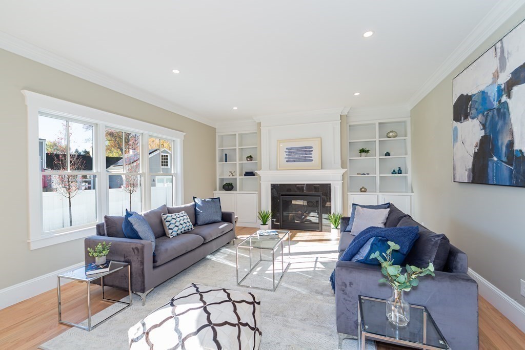 4 Whitcomb Street Natick, MA 01760 - Photo 19 of 42 a living room with furniture large window and a fireplace