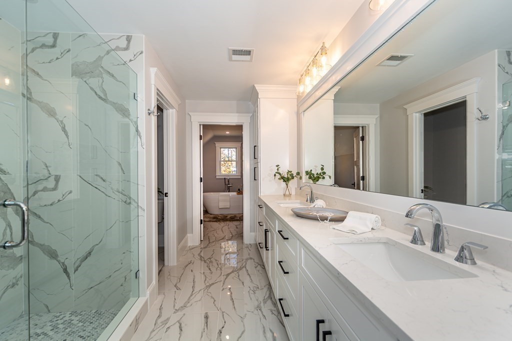4 Whitcomb Street Natick, MA 01760 - Photo 25 of 42 a spacious bathroom with a double vanity sink mirror and shower