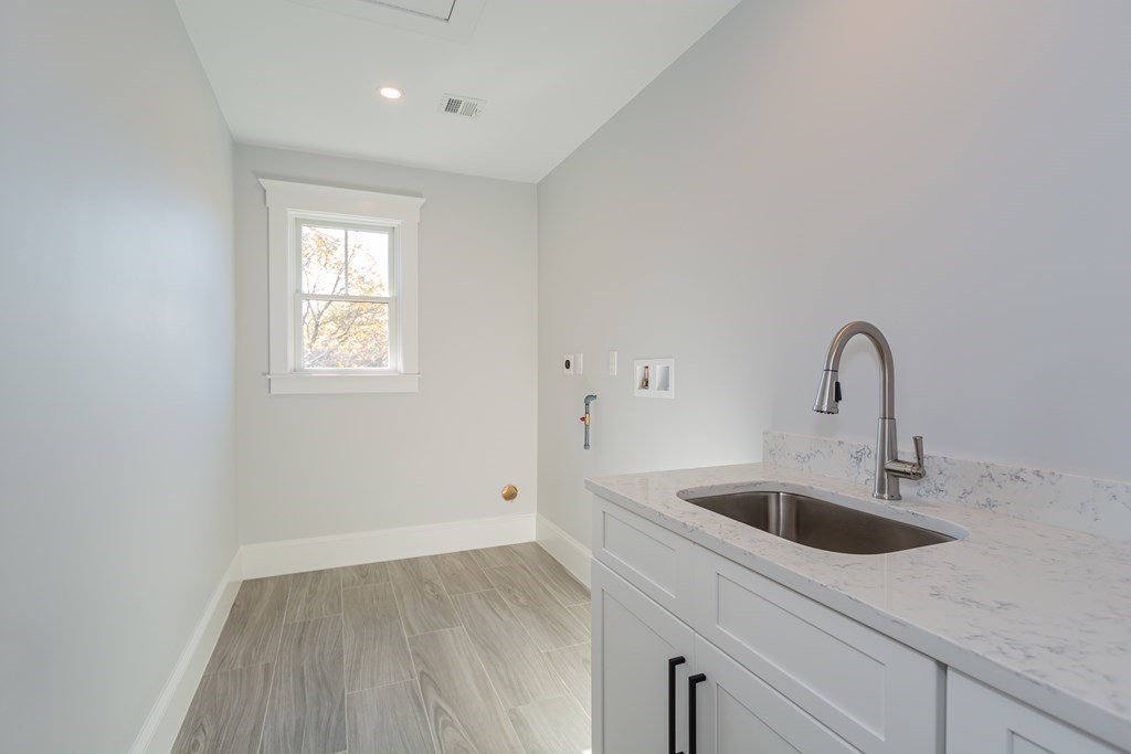 4 Whitcomb Street Natick, MA 01760 - Photo 29 of 42 a close view of a sink a faucet and appliance in the kitchen