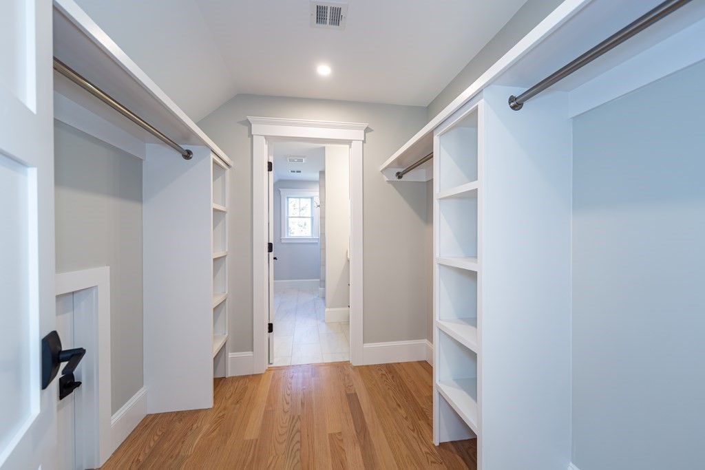 4 Whitcomb Street Natick, MA 01760 - Photo 31 of 42 a view of a hallway with wooden floor and staircase