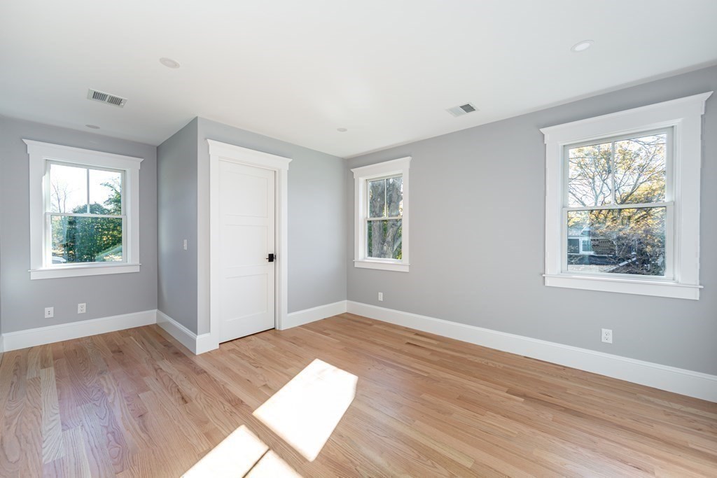 4 Whitcomb Street Natick, MA 01760 - Photo 34 of 42 an empty room with wooden floor and windows