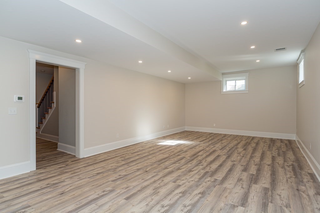 4 Whitcomb Street Natick, MA 01760 - Photo 36 of 42 a view of an empty room with wooden floor and closet