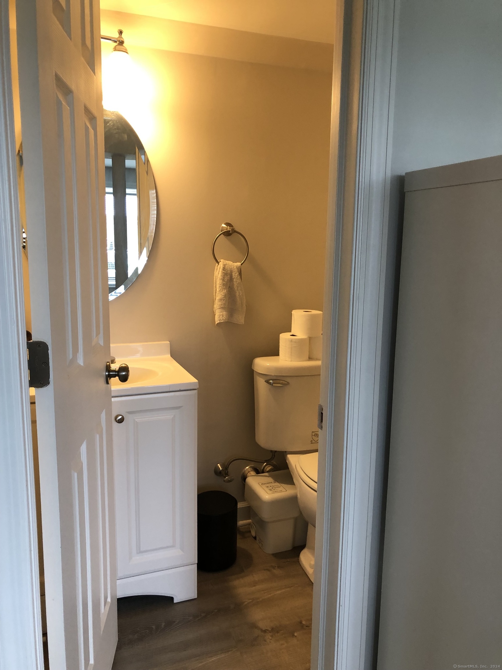 90 Iroquois Road, Unit A Stamford, CT 06902 - Photo 17 of 19 a bathroom with a toilet and a mirror