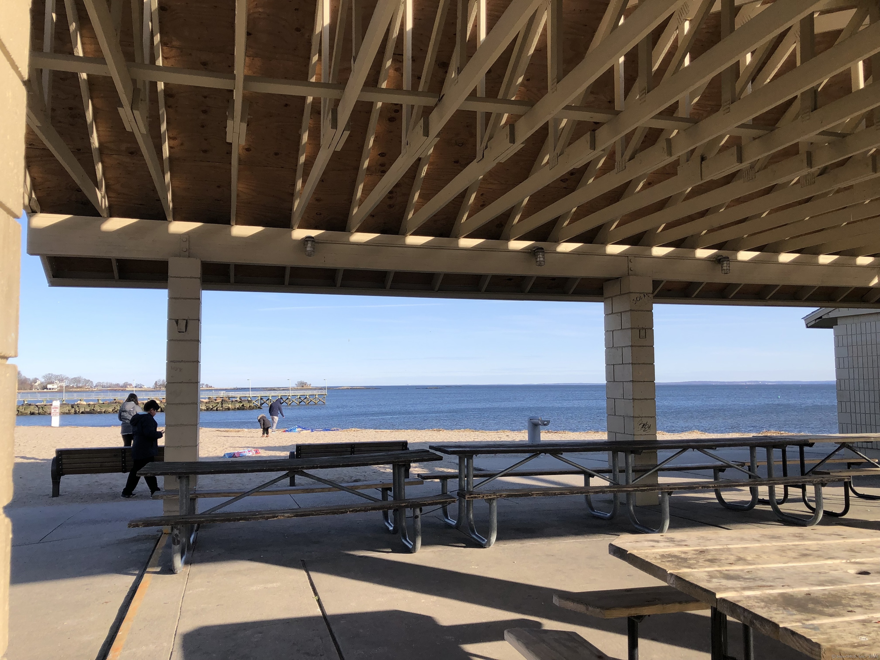 90 Iroquois Road, Unit A Stamford, CT 06902 - Photo 19 of 19 a living room with stainless steel appliances kitchen island granite countertop furniture and a view of kitchen