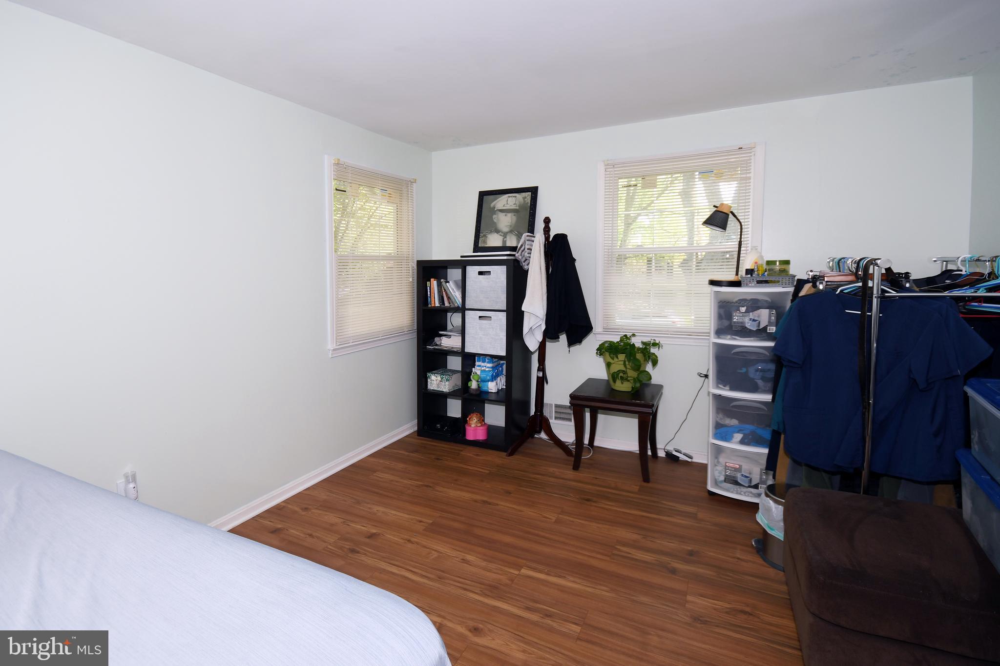 1402 Mullins Street Silver Spring, MD 20904 - Photo 12 of 29 a bedroom with a bed and a bookshelf