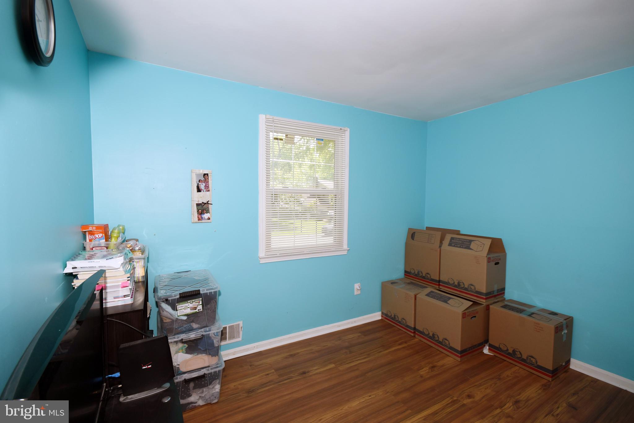 1402 Mullins Street Silver Spring, MD 20904 - Photo 13 of 29 a room with furniture and wooden floor