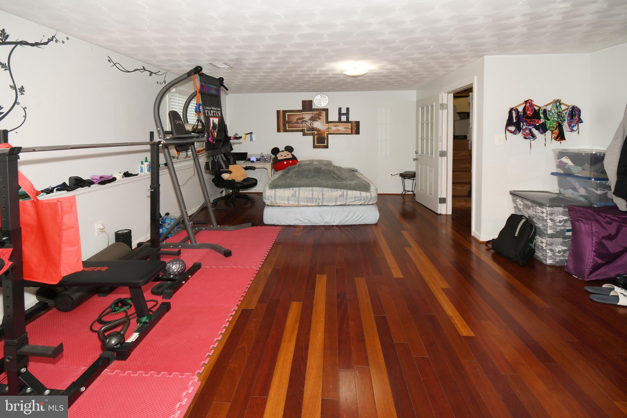 1402 Mullins Street Silver Spring, MD 20904 - Photo 16 of 29 a bed room with a bed and a couch