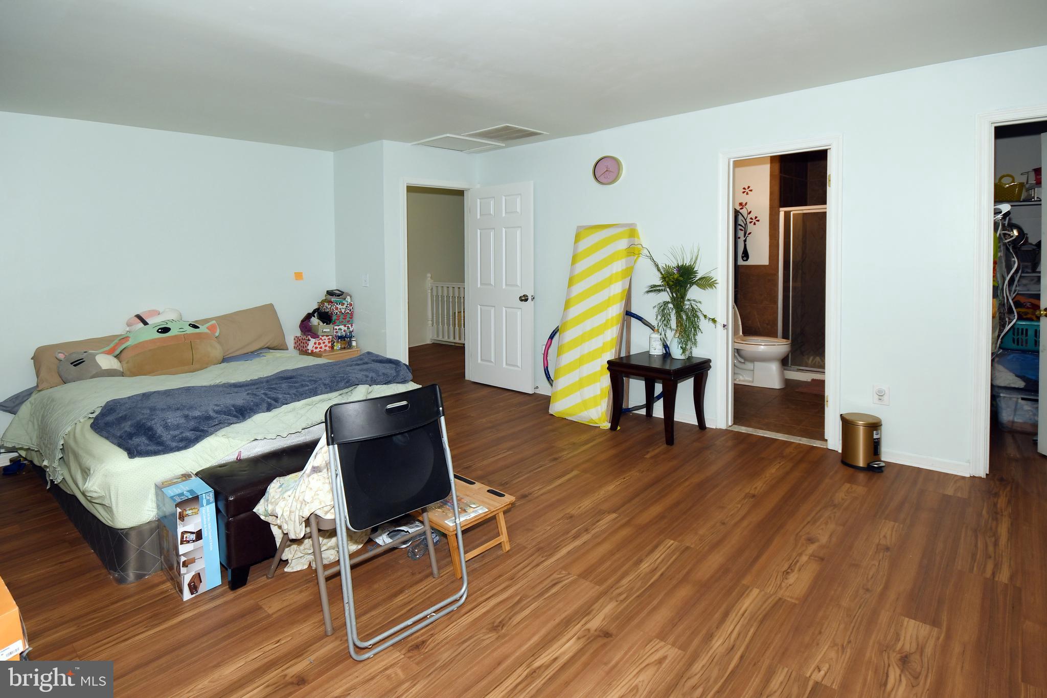 1402 Mullins Street Silver Spring, MD 20904 - Photo 21 of 29 a bedroom with a bed and a table