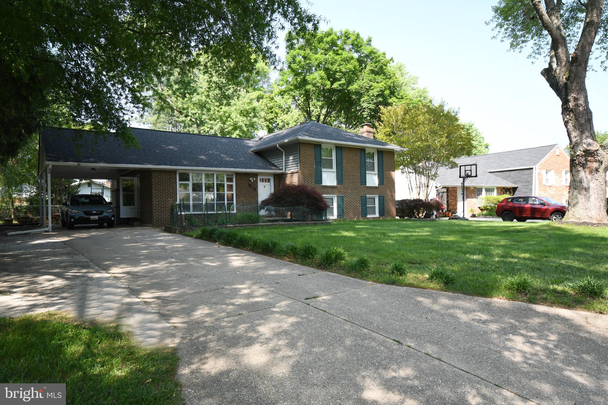1402 Mullins Street Silver Spring, MD 20904 - Photo 22 of 29 a front view of a house with a yard