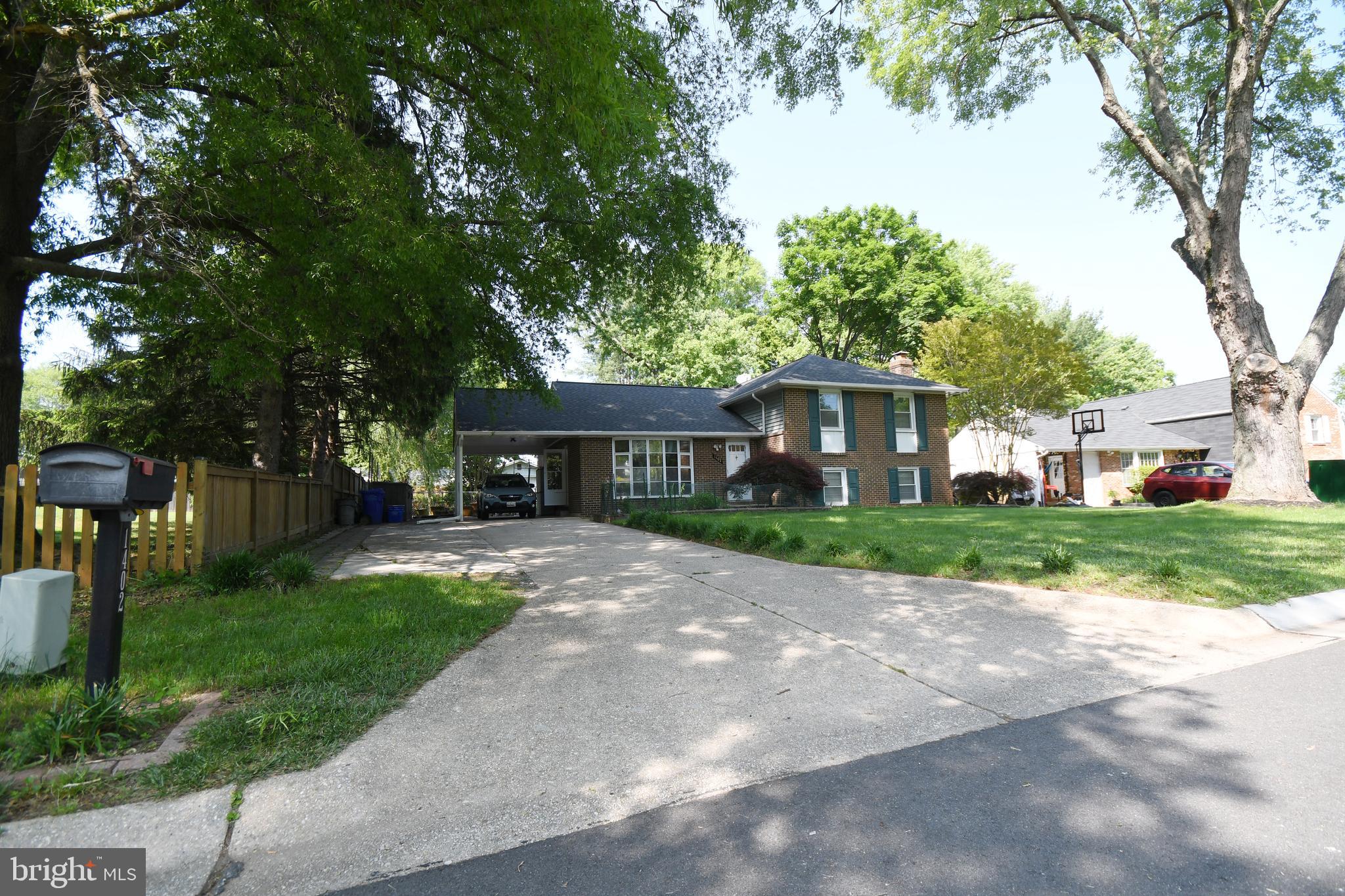 1402 Mullins Street Silver Spring, MD 20904 - Photo 24 of 29 a view of house in front of a big yard with large trees