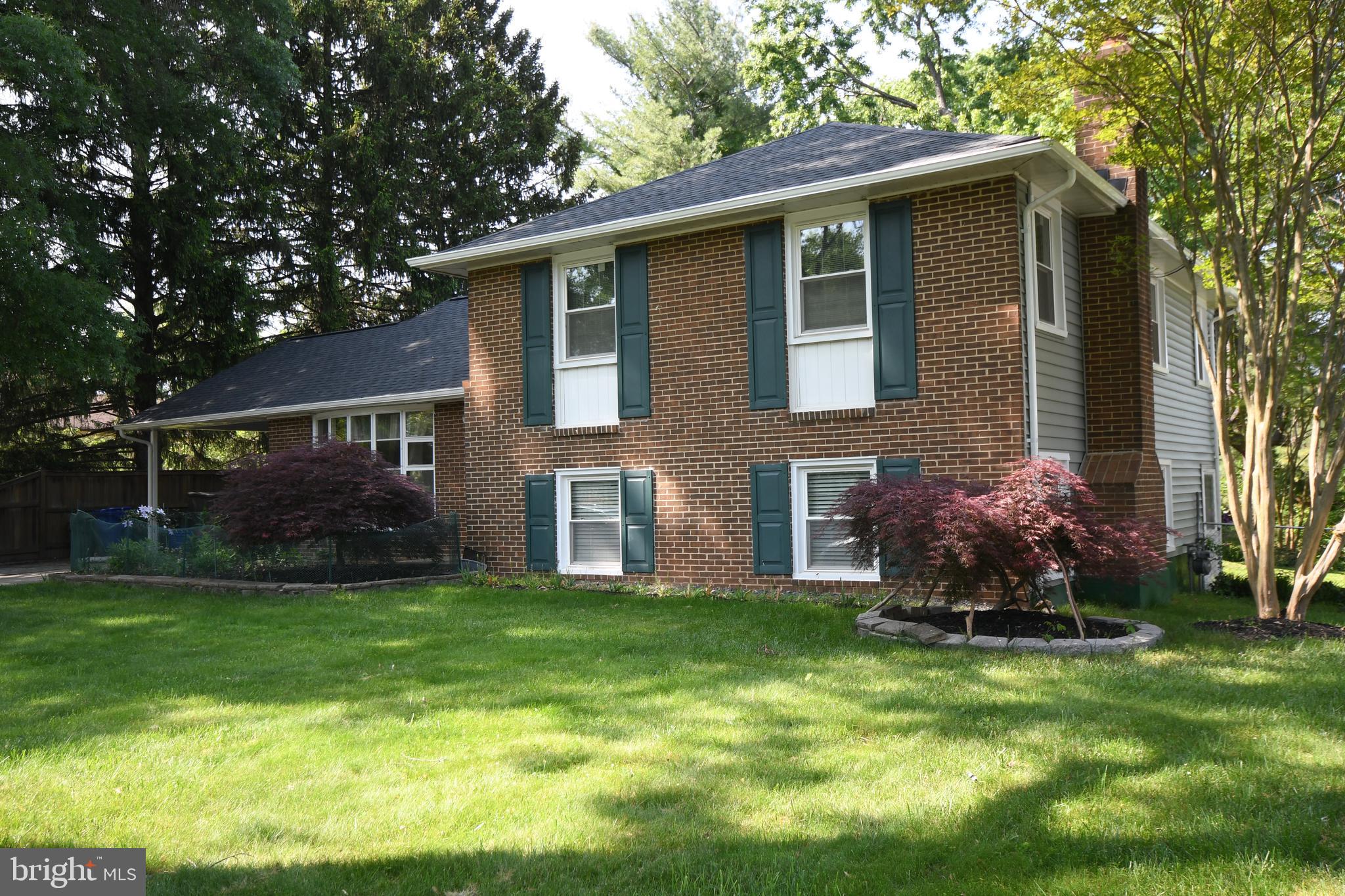 1402 Mullins Street Silver Spring, MD 20904 - Photo 25 of 29 a front view of house with a garden