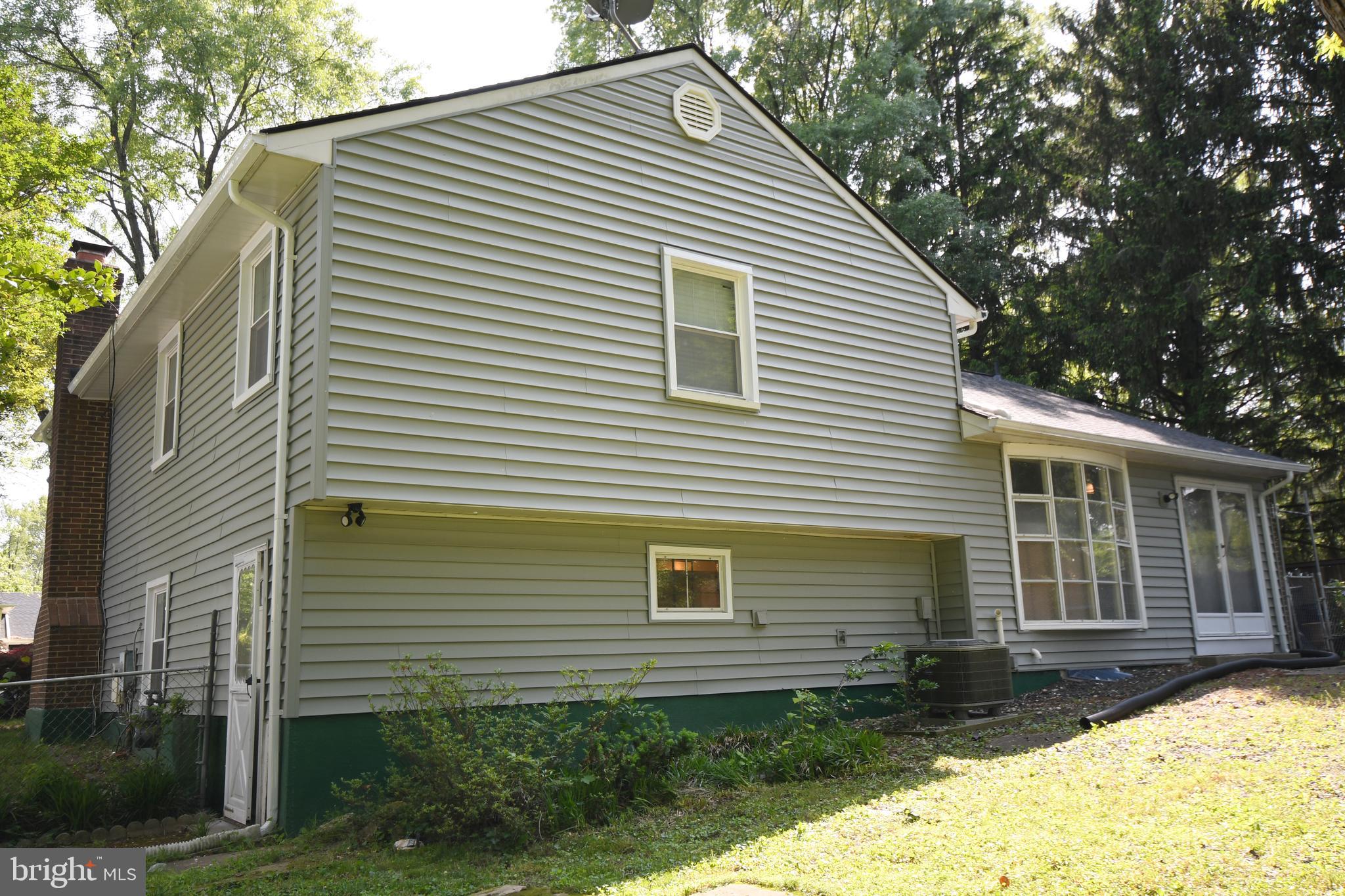 1402 Mullins Street Silver Spring, MD 20904 - Photo 26 of 29 a front view of a house with a yard and garage