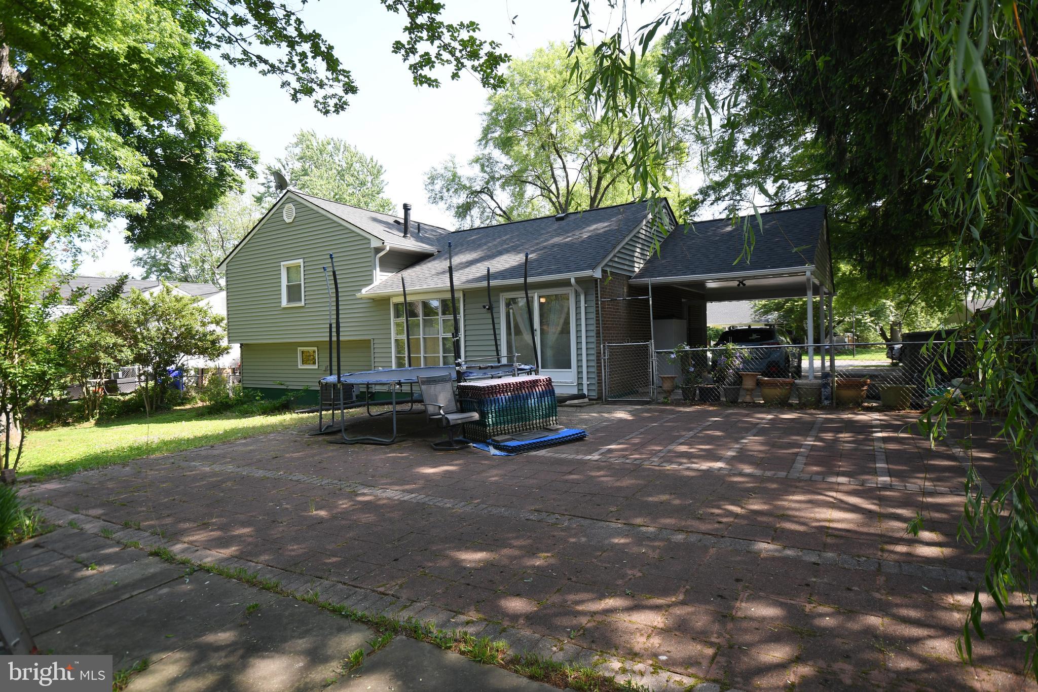 1402 Mullins Street Silver Spring, MD 20904 - Photo 27 of 29 a view of a house with a yard