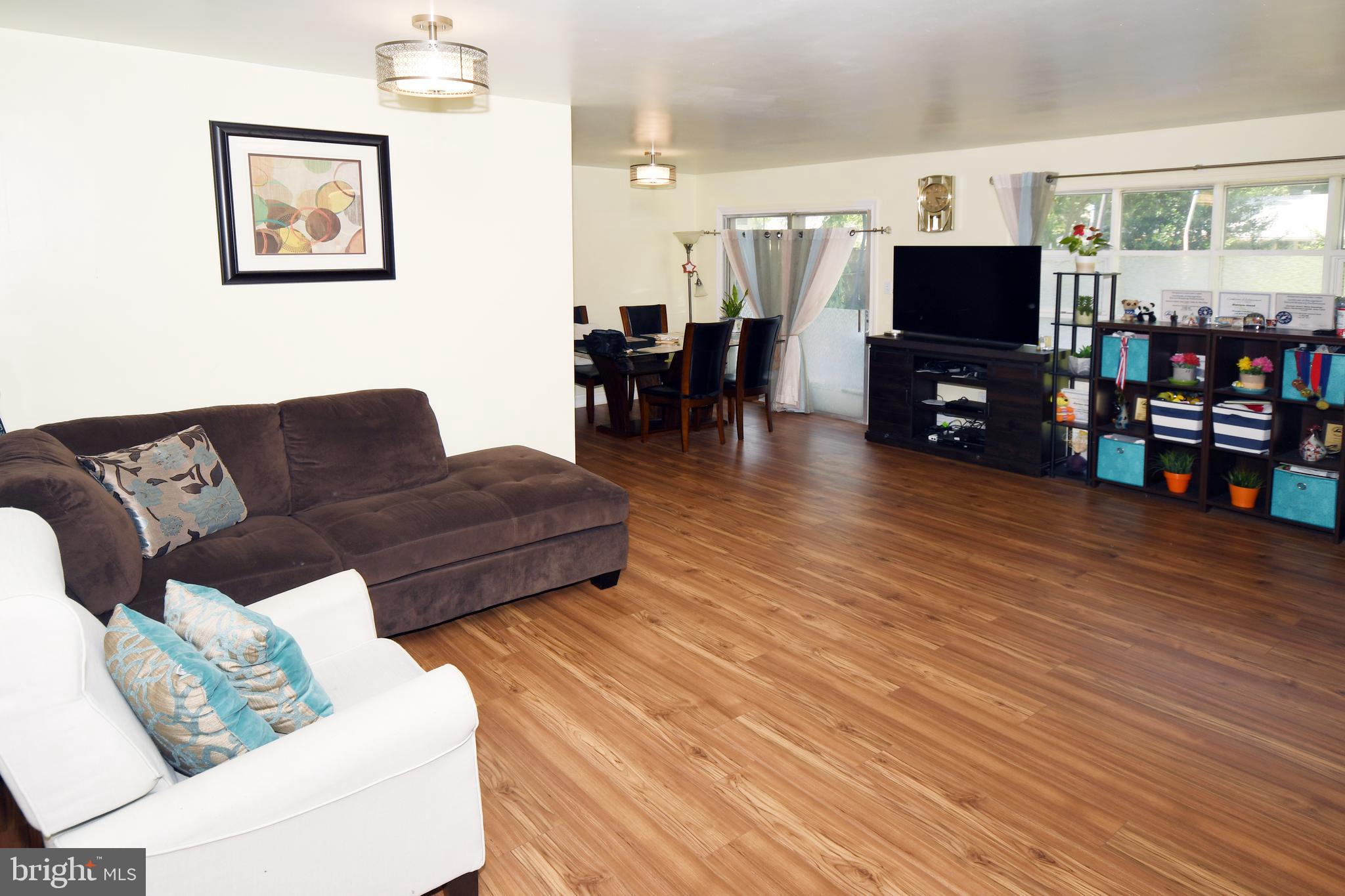1402 Mullins Street Silver Spring, MD 20904 - Photo 3 of 29 a living room with furniture and a flat screen tv