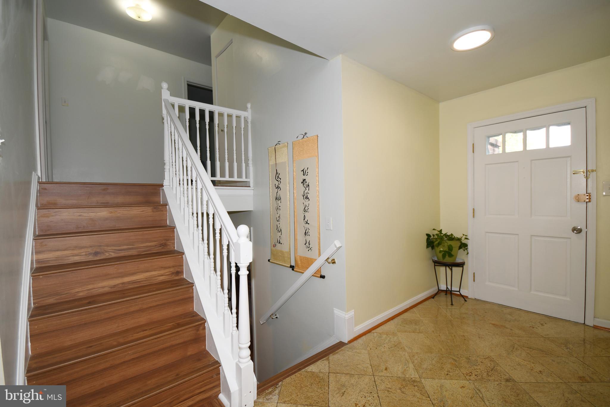 1402 Mullins Street Silver Spring, MD 20904 - Photo 10 of 29 a view of entryway with wooden floor and stairs