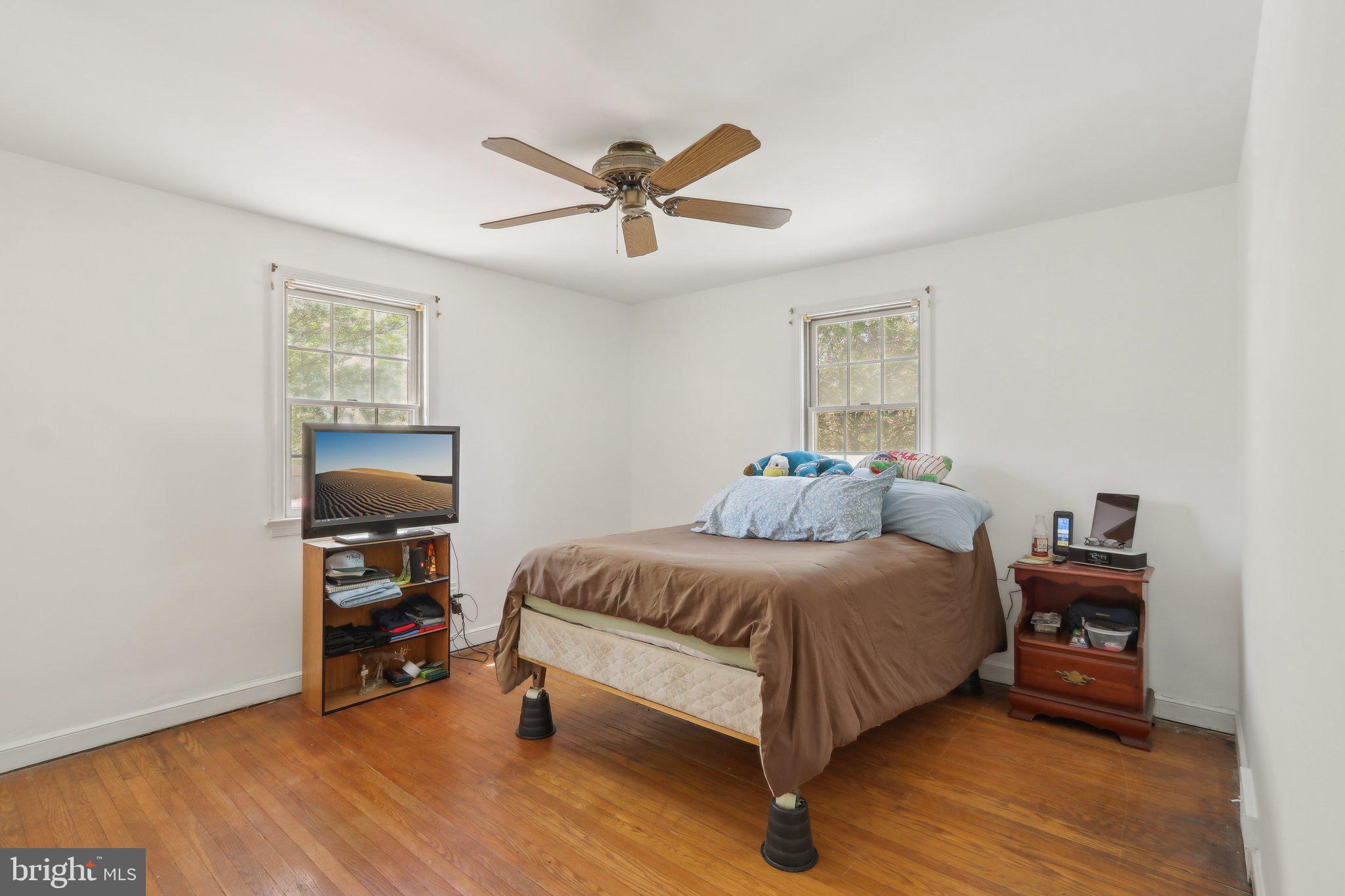 28 Barbara Road Hatboro, PA 19040 - Photo 16 of 33 a bedroom with a bed and a chandelier