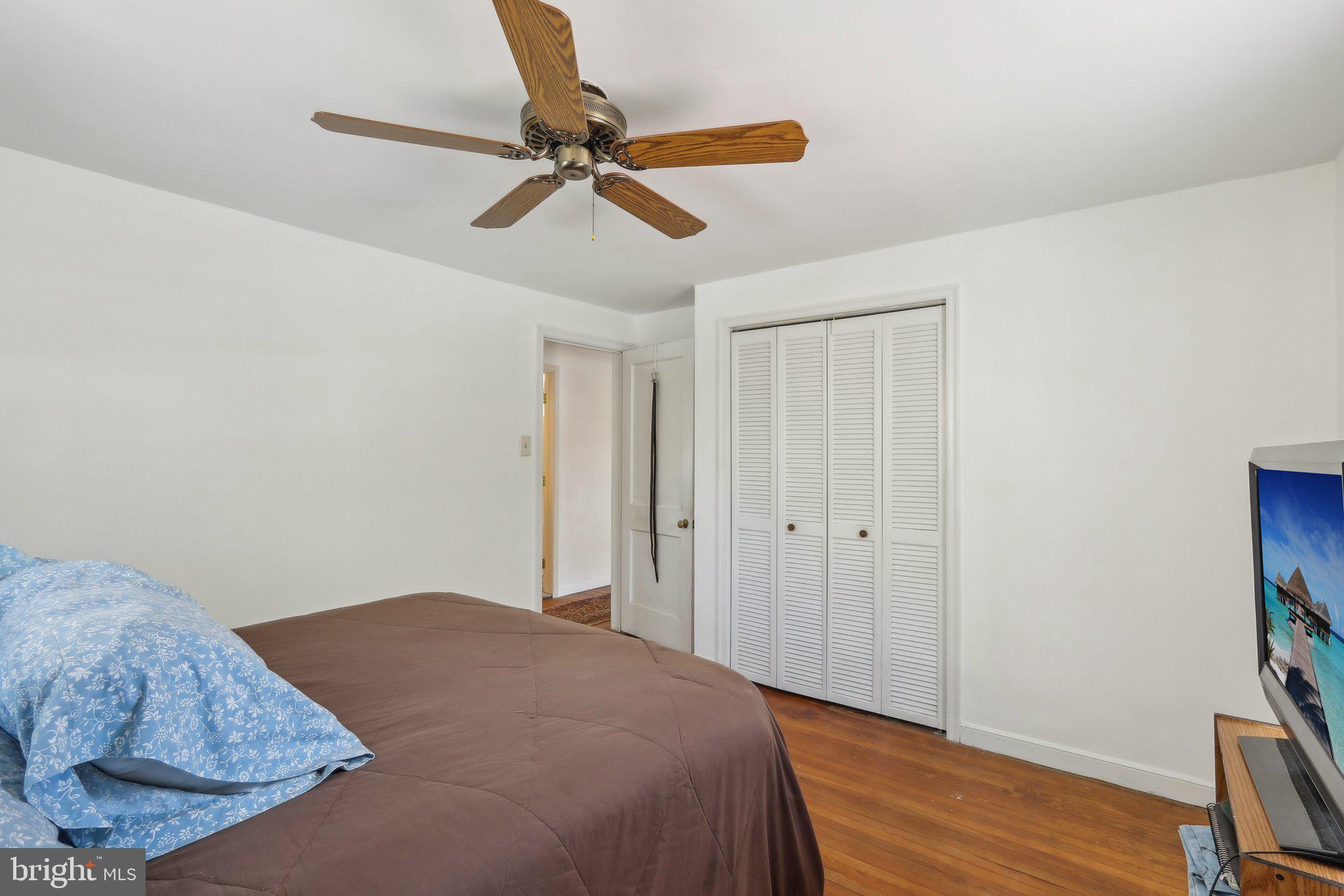 28 Barbara Road Hatboro, PA 19040 - Photo 17 of 33 a bedroom with a bed and a chandelier fan
