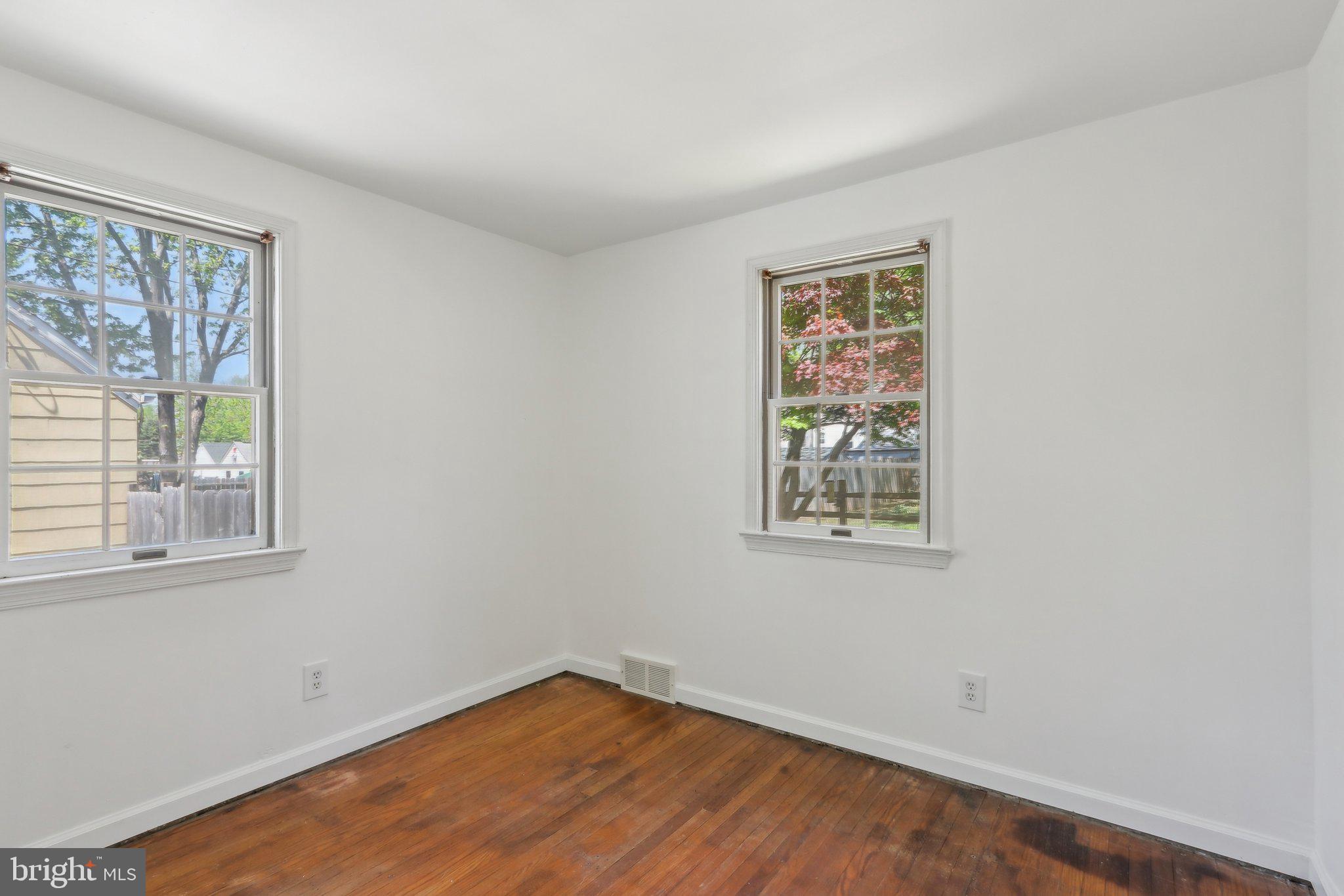 28 Barbara Road Hatboro, PA 19040 - Photo 19 of 33 a view of an empty room with wooden floor and a window