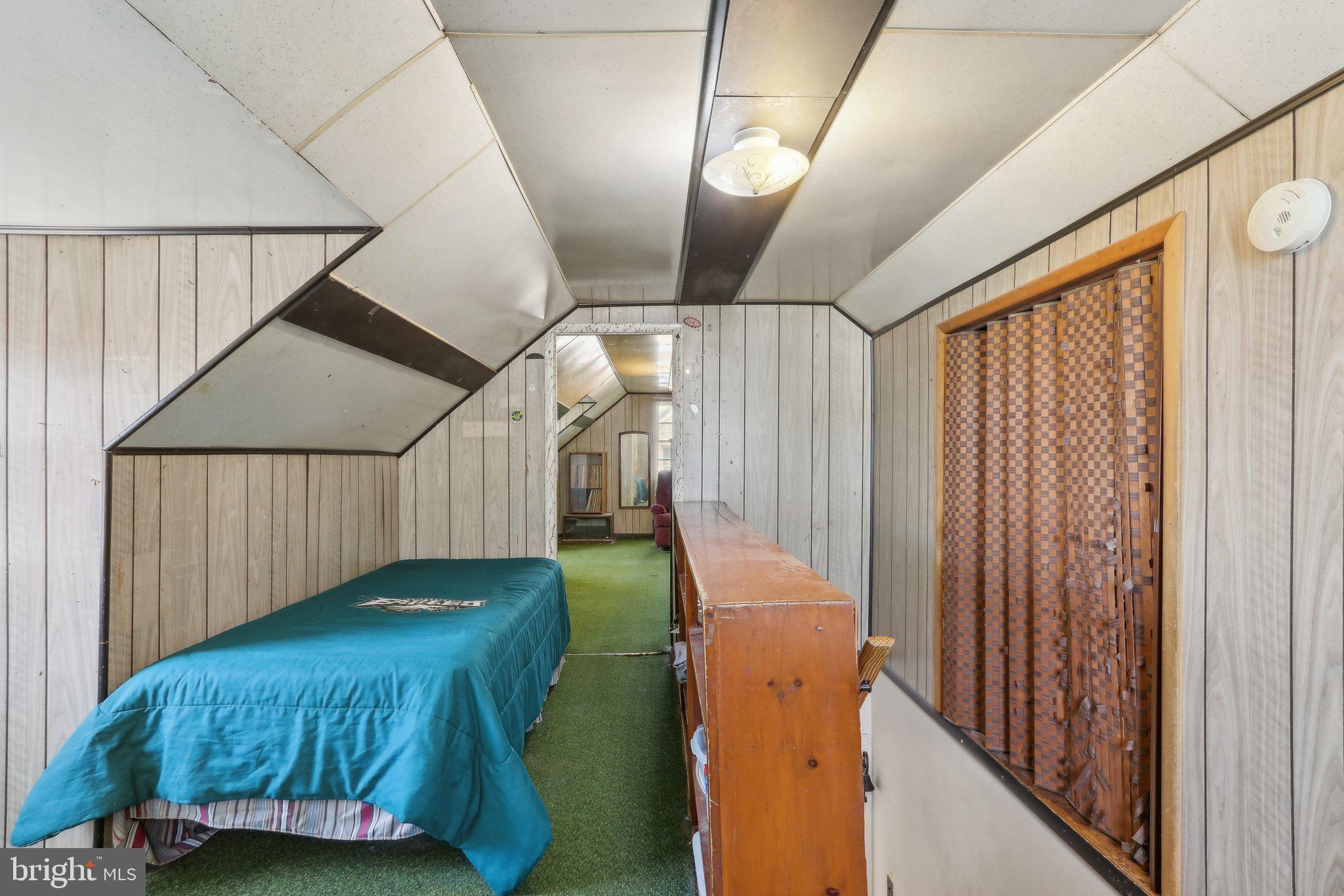 28 Barbara Road Hatboro, PA 19040 - Photo 24 of 33 a bed room with a bed and a chandelier