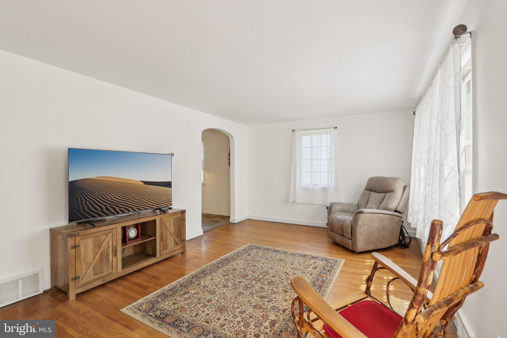 28 Barbara Road Hatboro, PA 19040 - Photo 3 of 33 a living room with furniture and a flat screen tv