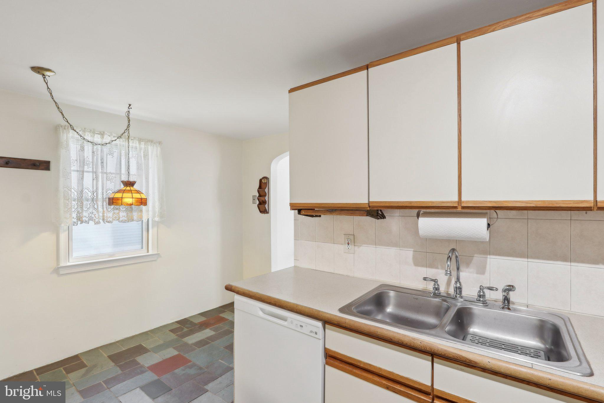 28 Barbara Road Hatboro, PA 19040 - Photo 9 of 33 a kitchen with a sink and a window