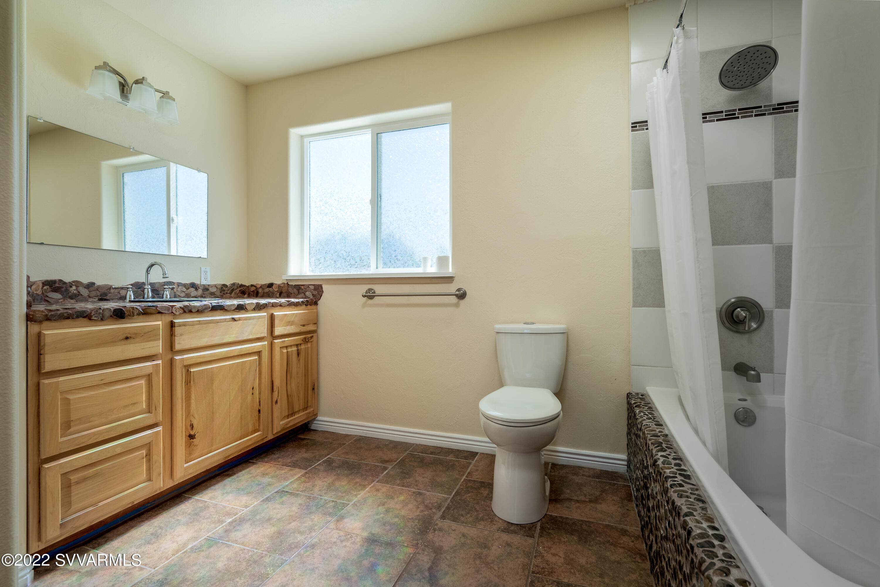 4455 Eagles Roost Road Rimrock, AZ 86335 - Photo 13 of 31 a bathroom with a sink toilet and shower