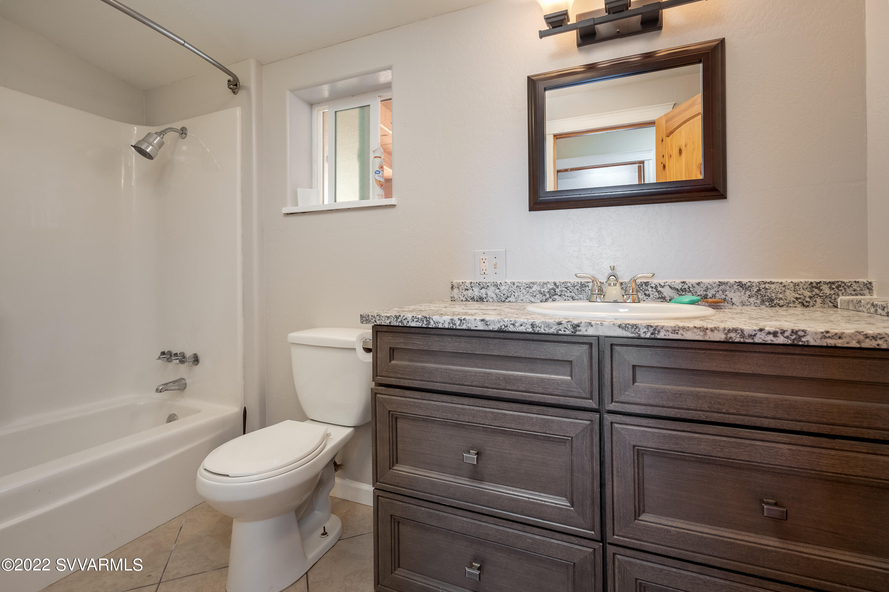 4455 Eagles Roost Road Rimrock, AZ 86335 - Photo 17 of 31 a bathroom with a toilet sink and tub