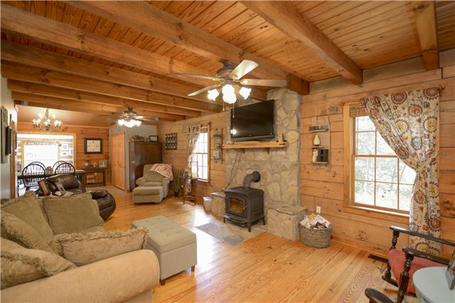 396 Pee Dee Branch Road, Unit 396B Cottontown, TN 37048 - Photo 3 of 20 You will feel right at home from the minute you walk in with the welcoming amenities including the Pine Floors, Beamed Ceilings and the Stone Fireplace with Wood Burning Stove.