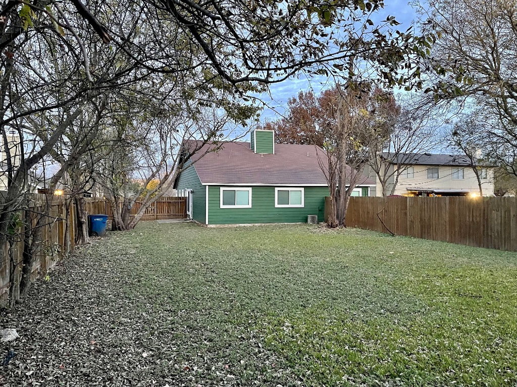 10003 Parliament House Road Austin, TX 78717 - Photo 14 of 31 a front view of a house with yard and green space