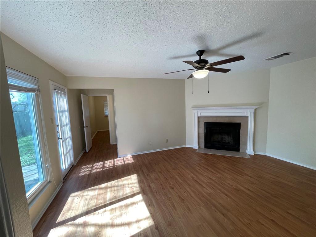 10003 Parliament House Road Austin, TX 78717 - Photo 17 of 31 a view of an empty room with a fireplace and a window