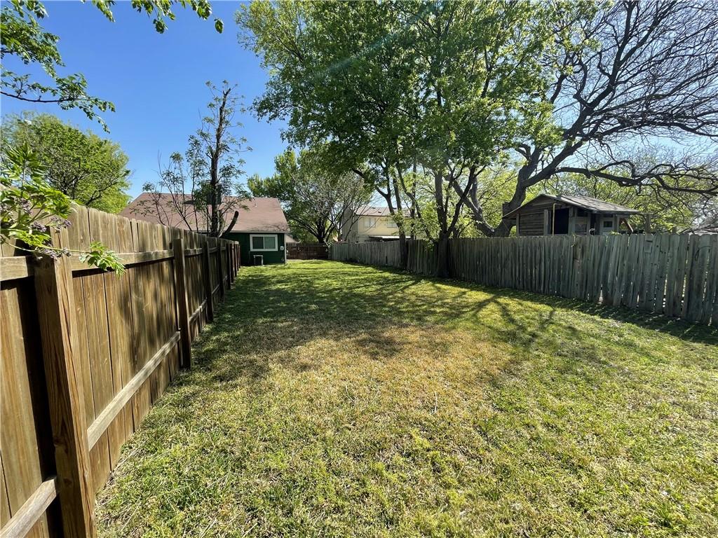 10003 Parliament House Road Austin, TX 78717 - Photo 28 of 31 a view of a backyard with wooden fence