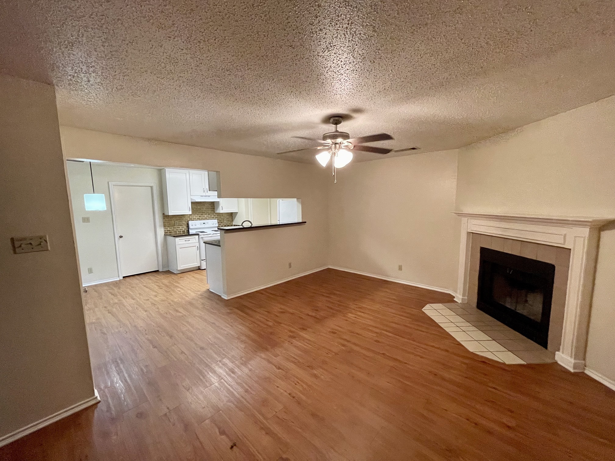10003 Parliament House Road Austin, TX 78717 - Photo 8 of 31 a view of a room with wooden floor and kitchen view