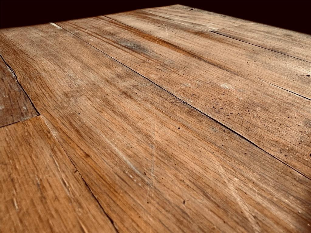 2250 West Kaufman Street Paris, TX 75460 - Photo 22 of 36 a bedroom with a bed and wooden floor