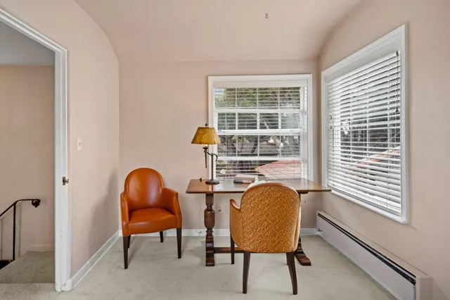 a view of a hallway with bathroom