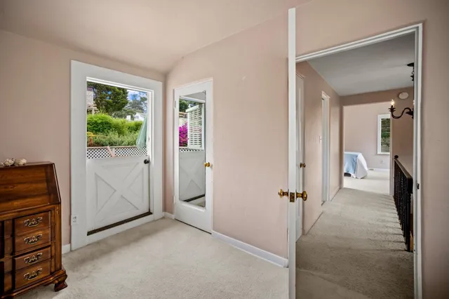 a view of a patio with a table and chairs