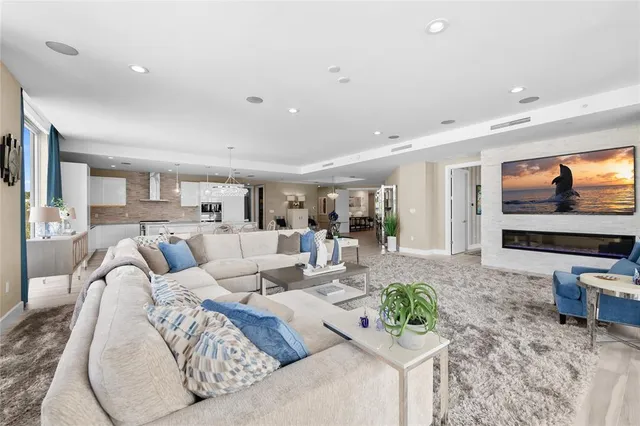 a bathroom with a double vanity sink a mirror and a bathtub