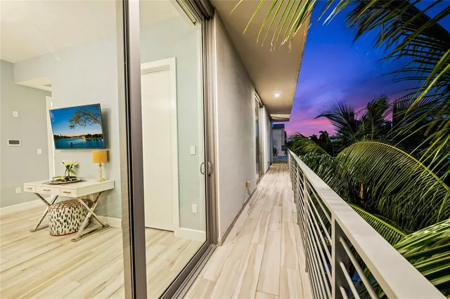 a bathroom with a shower a toilet and a glass window