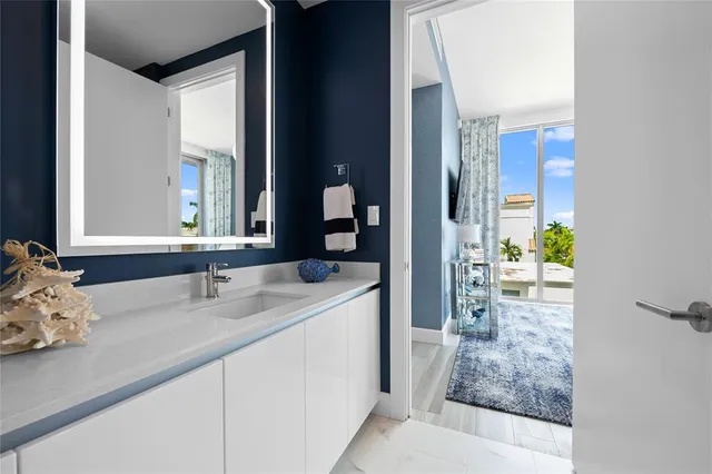 a view of a chairs and table in the balcony