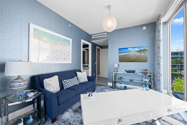 a view of balcony with seating space and wooden floor