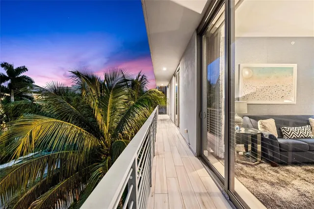 an aerial view of a house with a lake view