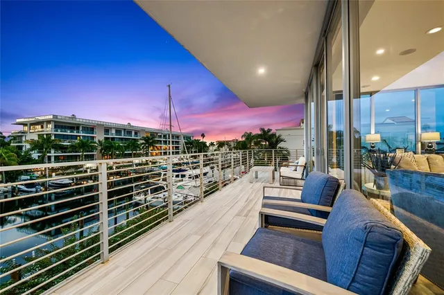 a large kitchen with granite countertop a large counter top appliances and cabinets