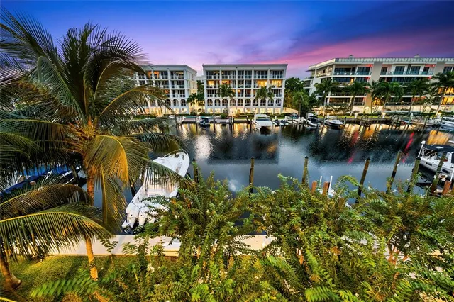 a living room with furniture a wooden floor and next to a window