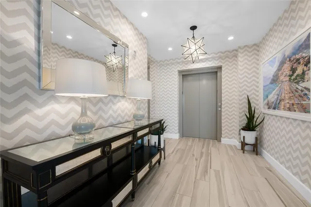 a living room with a couch and wooden floor