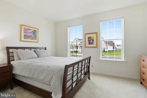 a bedroom with bed and a window