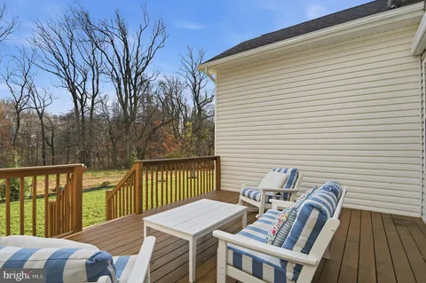 a view of a two chairs in the balcony