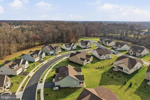 a view of a swimming pool with lounge chairs
