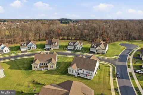 an aerial view of a house with a swimming pool